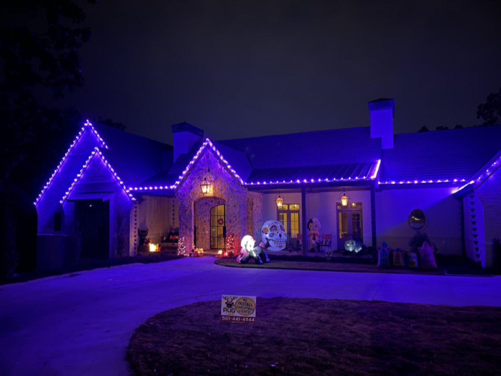 Home decorated with purple Halloween lighting and decorations