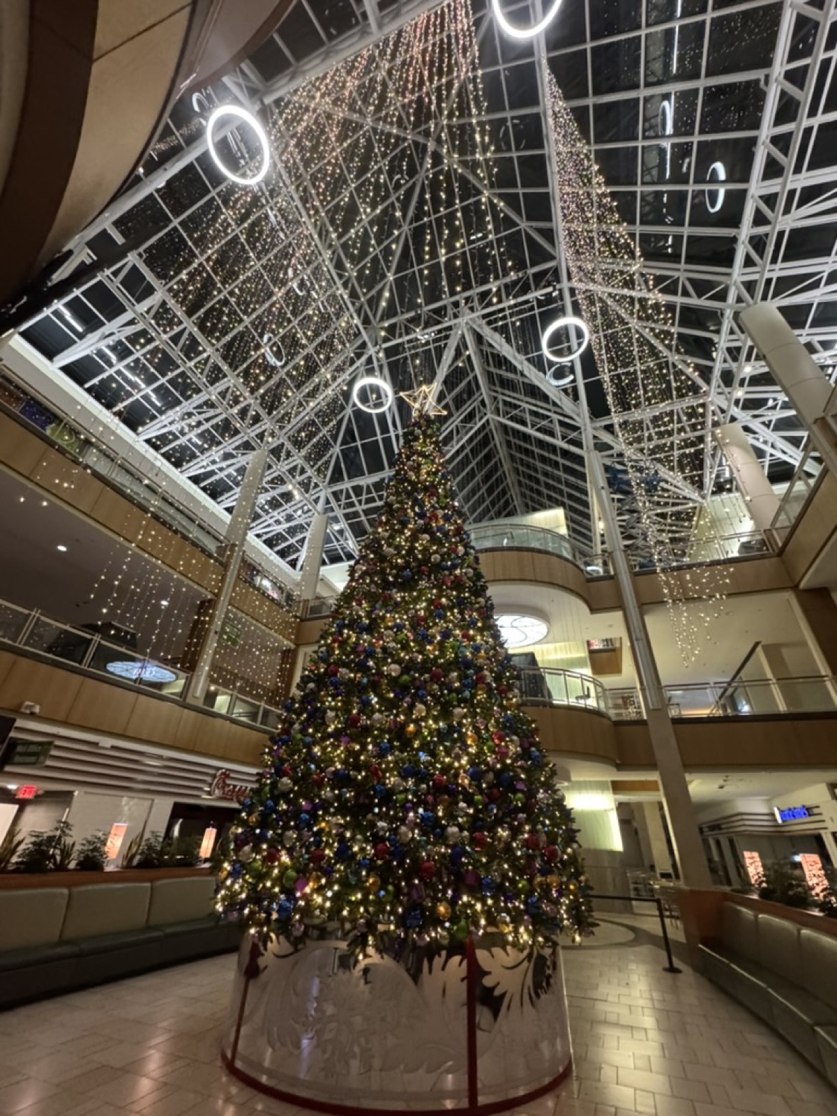 Large decorated Christmas tree inside Park Plaza Mall, view from below